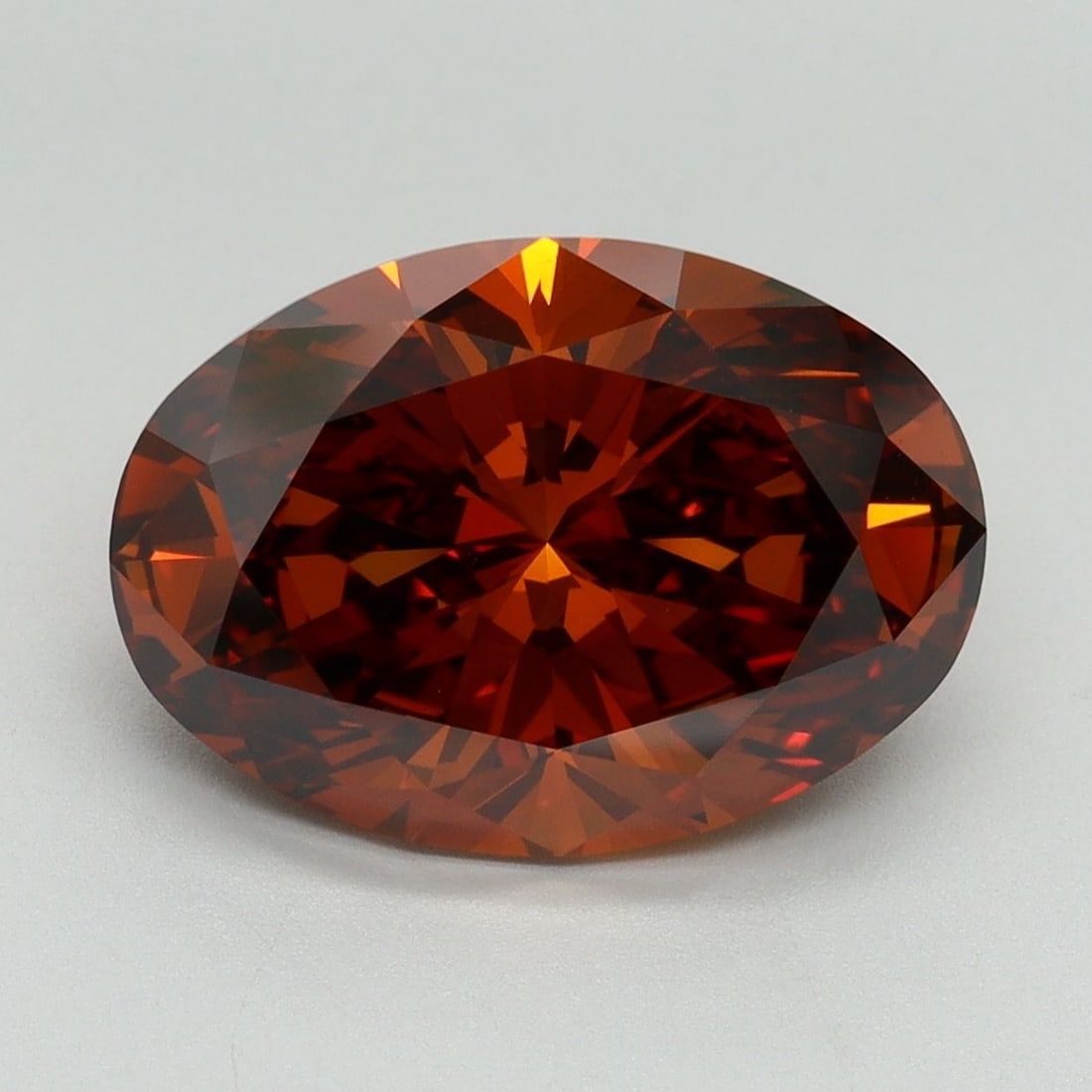 IGI Oval 5.08ct Fancy Orange VVS2 Loose Lab Diamond: IGI Oval 5.08ct Fancy Orange VVS2 Loose Lab Diamond Experience the vibrant beauty of a Fancy Orange VVS2 lab diamond, boasting an exceptional 5.08 carat weight and EX symmetry. This stunning gemstone,