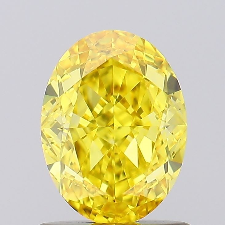 IGI Oval 1.1ct Fancy Vivid Yellow VVS2 Loose Lab Diamond: IGI Oval 1.1ct Fancy Vivid Yellow VVS2 Loose Lab Diamond A stunning Fancy Vivid Yellow diamond, certified by the International Gemological Institute (IGI), boasts exceptional clarity and polish, with