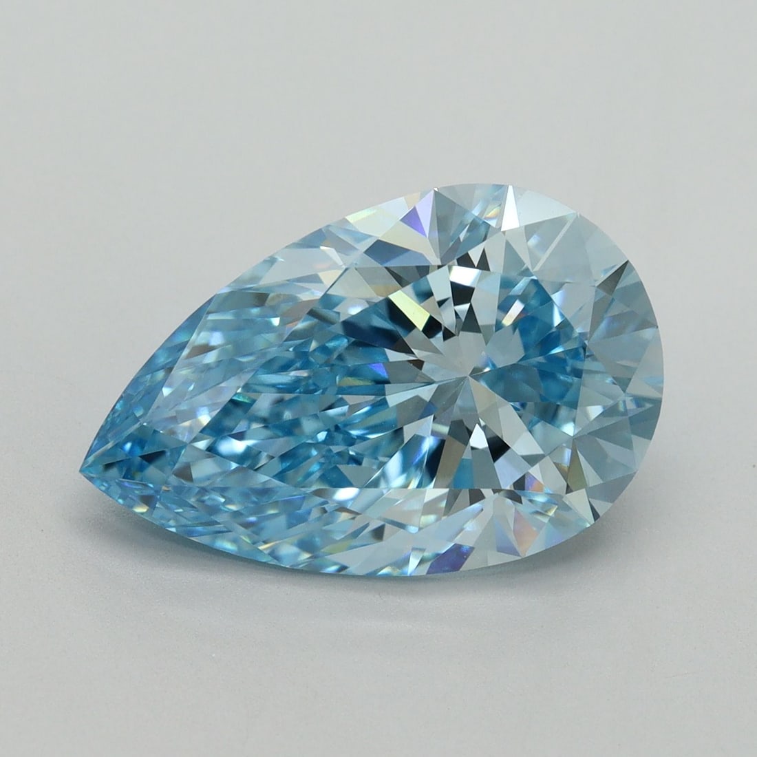 Loose Lab Diamond - IGI Pear 6.18ct Fancy Vivid Blue VVS2: Loose Lab Diamond - IGI Pear 6.18ct Fancy Vivid Blue VVS2 Experience the breathtaking beauty of a lab-grown diamond, certified by the International Gemological Institute (IGI) as Fancy Vivid Blue, wit