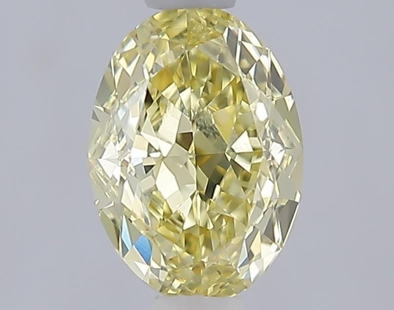 IGI Oval 1.09ct Fancy Yellow VVS2 Loose Lab Diamond: IGI Oval 1.09ct Fancy Yellow VVS2 Loose Lab Diamond Experience the unique beauty of a Fancy Yellow diamond, one of the rarest and most coveted colors in nature. This exquisite 1.09ct lab-grown IGI Ova