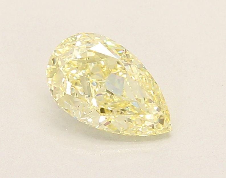 Loose Lab Diamond - IGI Pear 1.04ct Fancy Yellow VVS2: Loose Lab Diamond - IGI Pear 1.04ct Fancy Yellow VVS2 A rare and radiant gem, this 1.04ct Fancy Yellow Lab Diamond boasts exceptional clarity (VVS2) and luster (EX Polish), making it a standout among