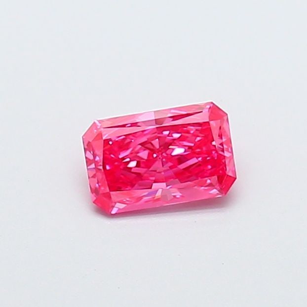 IGI Radiant 0.54ct Fancy Vivid Pink VVS2 Loose Lab Diamond: IGI Radiant 0.54ct Fancy Vivid Pink VVS2 Loose Lab Diamond Experience the beauty of a rare and vibrant Fancy Vivid Pink diamond, certified by the International Gemological Institute (IGI). This stunni