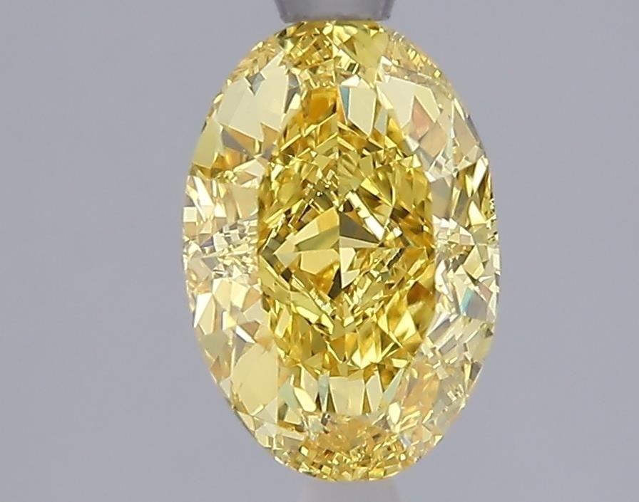 IGI Oval 2.02ct Fancy Vivid Yellow VVS2 Loose Lab Diamond: IGI Oval 2.02ct Fancy Vivid Yellow VVS2 Loose Lab Diamond Experience the brilliance of nature in a lab-grown diamond, certified by IGI as Fancy Vivid Yellow with exceptional clarity and cut. This 2.02
