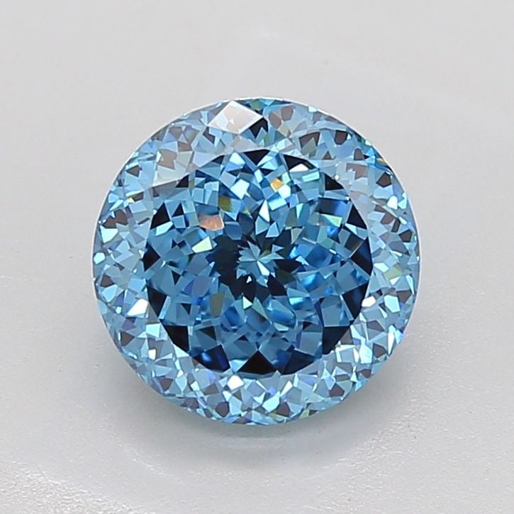 IGI Round 3.53ct Fancy Vivid Blue VVS2 Diamond: IGI Round 3.53ct Fancy Vivid Blue VVS2 Diamond Experience the breathtaking beauty of this 3.53ct Fancy Vivid Blue VVS2 diamond, certified by the International Gemological Institute (IGI). Its