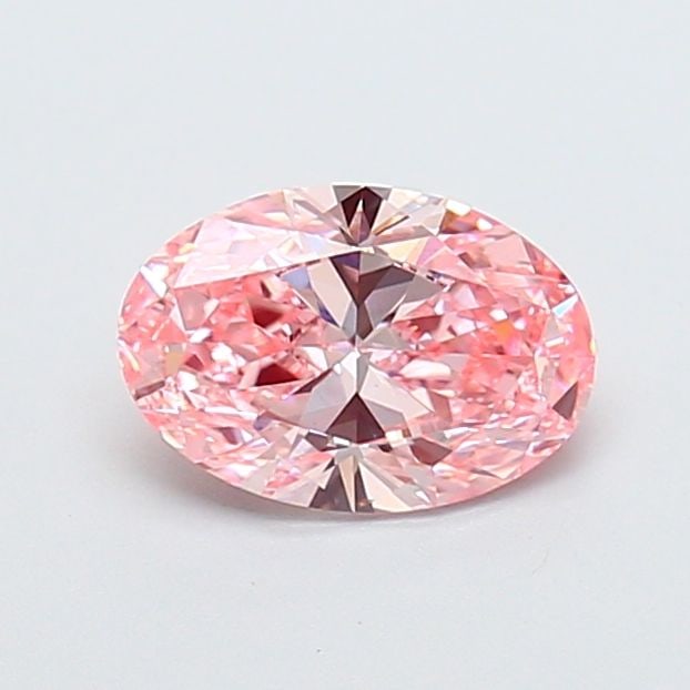 IGI Oval 1.07ct Fancy Vivid Pink VVS2 Loose Lab Diamond: IGI Oval 1.07ct Fancy Vivid Pink VVS2 Loose Lab Diamond Experience the rare beauty of a Fancy Vivid Pink diamond, one of the most coveted colors in diamonds. This 1.07ct lab-grown gem boasts exception