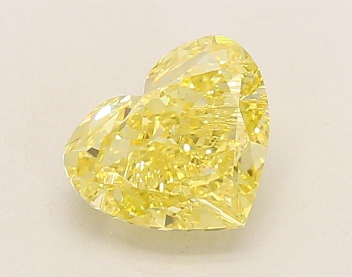 IGI Heart 1.2ct Fancy Intense Yellow VVS2 Loose Lab Diamond: IGI Heart 1.2ct Fancy Intense Yellow VVS2 Loose Lab Diamond A rare and vibrant Fancy Intense Yellow diamond, certified by the International Gemological Institute (IGI), boasts exceptional clarity and