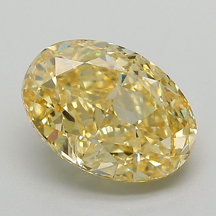 IGI Oval 3.04ct Fancy Vivid Yellow VVS2 Diamond: IGI Oval 3.04ct Fancy Vivid Yellow VVS2 Diamond Experience the warmth and brightness of a lab-grown diamond, boasting an impressive 3.04 carats of Fancy Vivid Yellow VVS2 clarity, making it a true sta