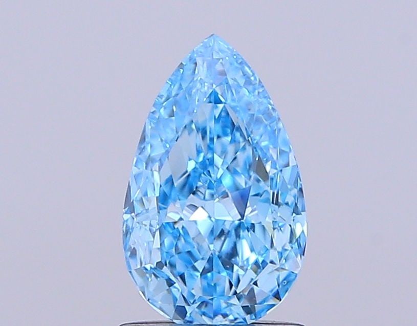 Loose Lab Diamond - IGI Pear 1.34ct Fancy Vivid Blue VVS2: Loose Lab Diamond - IGI Pear 1.34ct Fancy Vivid Blue VVS2 A stunning Fancy Vivid Blue lab diamond, certified by the International Gemological Institute (IGI), boasts exceptional clarity and polish,