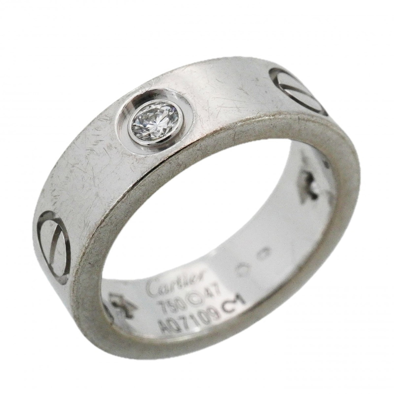 Cartier 18k White Gold Band Ring: Cartier 18k White Gold Band Ring A stunning Cartier band ring in 18k white gold, adorned with a diamond, adds a touch of timeless elegance to any outfit. With its classic design and luxurious material