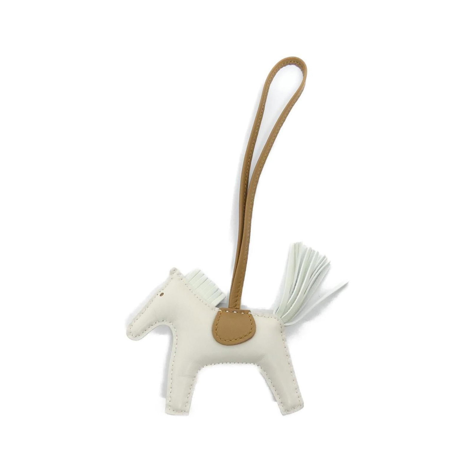 Hermes Agneau Milo Handbag Charm: Hermes Agneau Milo Handbag Charm A rare and elegant Hermes Agneau Milo handbag charm, crafted from the finest white Agneau Milo material, adds a touch of sophistication to any accessory. Its classic d