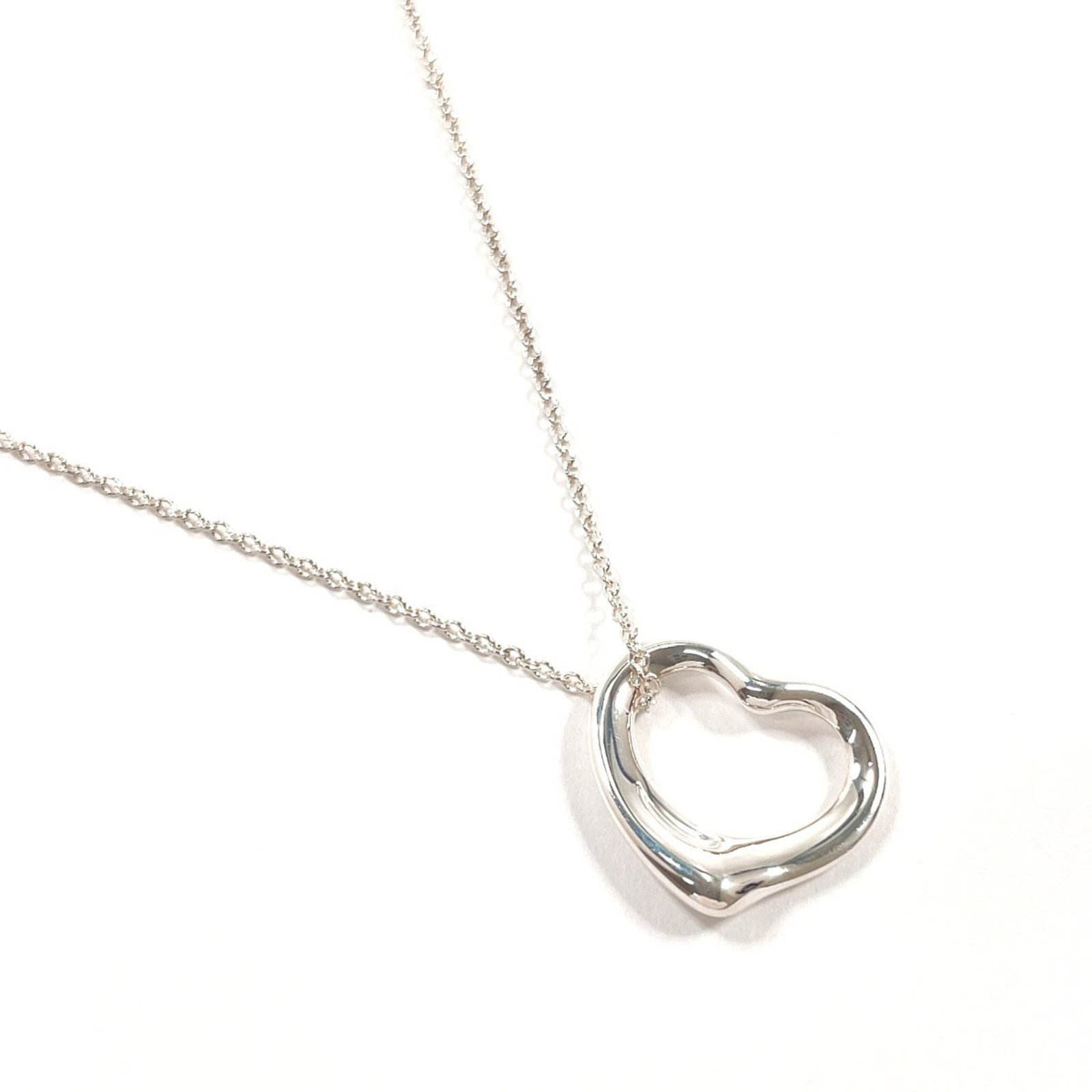 Tiffany & Co. Sterling Silver 925 Elsa Peretti Open Heart Necklace for Women: Tiffany & Co. Sterling Silver 925 Elsa Peretti Open Heart Necklace for Women Elegant and sophisticated, the Tiffany & Co. Sterling Silver 925 Elsa Peretti Open Heart Necklace is a timeless piece of je
