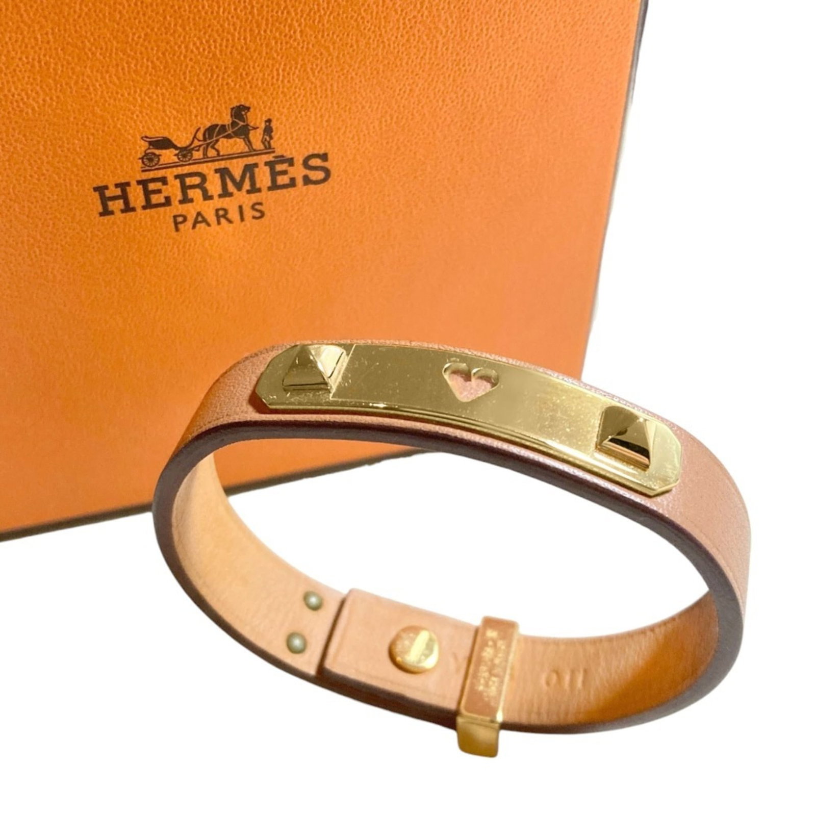 Hermes Swift Leather Charm Bracelet: Hermes Swift Leather Charm Bracelet Elevate your style with the iconic Hermes Swift Leather Charm Bracelet, boasting sleek brown swift leather and a timeless design that exudes effortless chic. With i