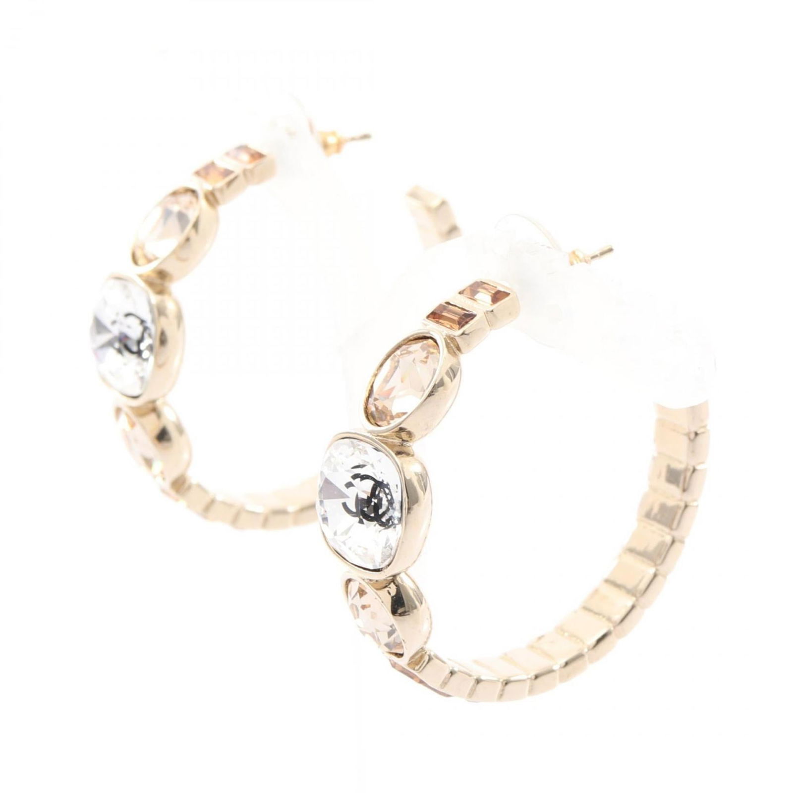 Rhinestone - Chanel Hoop Earrings Gold Plating: Rhinestone - Chanel Hoop Earrings Gold Plating Add a touch of luxury to your everyday look with these stunning Chanel hoop earrings, featuring intricate gold plating and sparkling clear rhinestones th