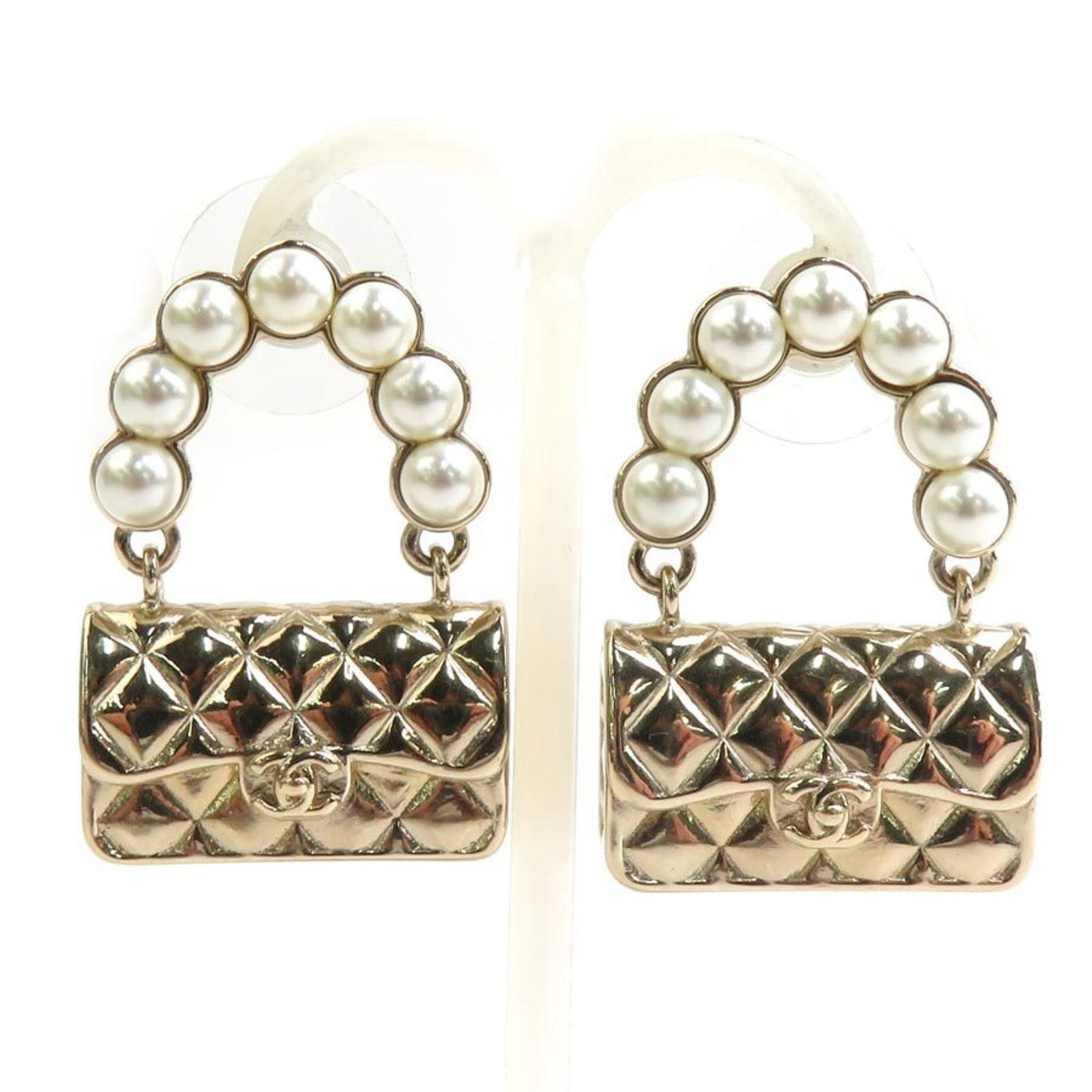 Metal - Chanel Stud Earrings Artificial Pearl: Metal - Chanel Stud Earrings Artificial Pearl Elevate your style with these stunning Chanel stud earrings, featuring artificial pearls and a luxurious gold finish. With their sleek design and subtle s