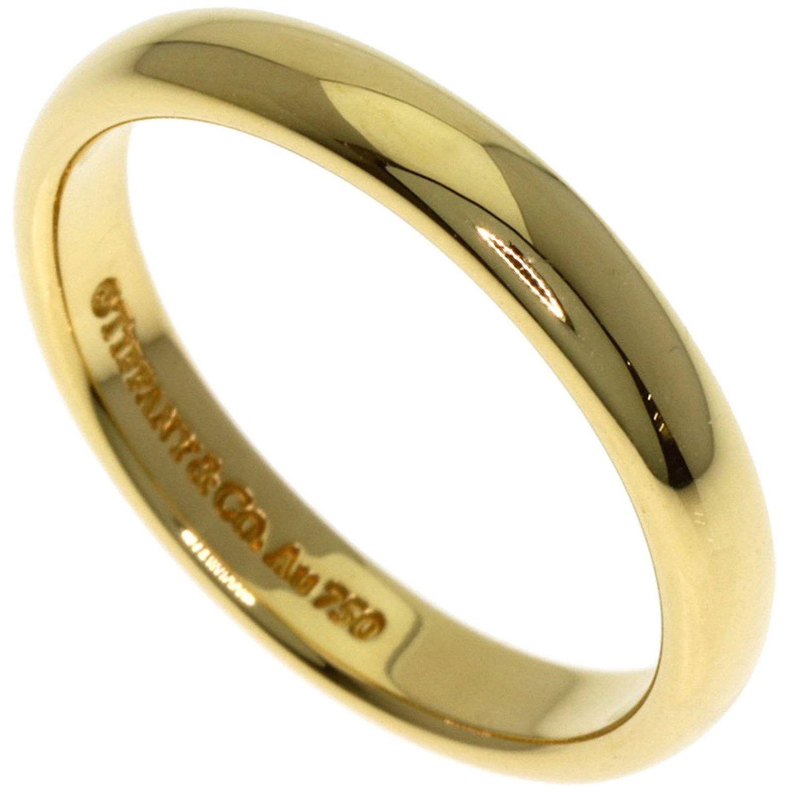 (18K) Tiffany Wedding Ring Yellow Gold: (18K) Tiffany Wedding Ring Yellow Gold A stunning 18K yellow gold Tiffany wedding ring, perfect for the romantic bride-to-be. With its sleek 3.1mm width and durable 18K construction, this timeless pie