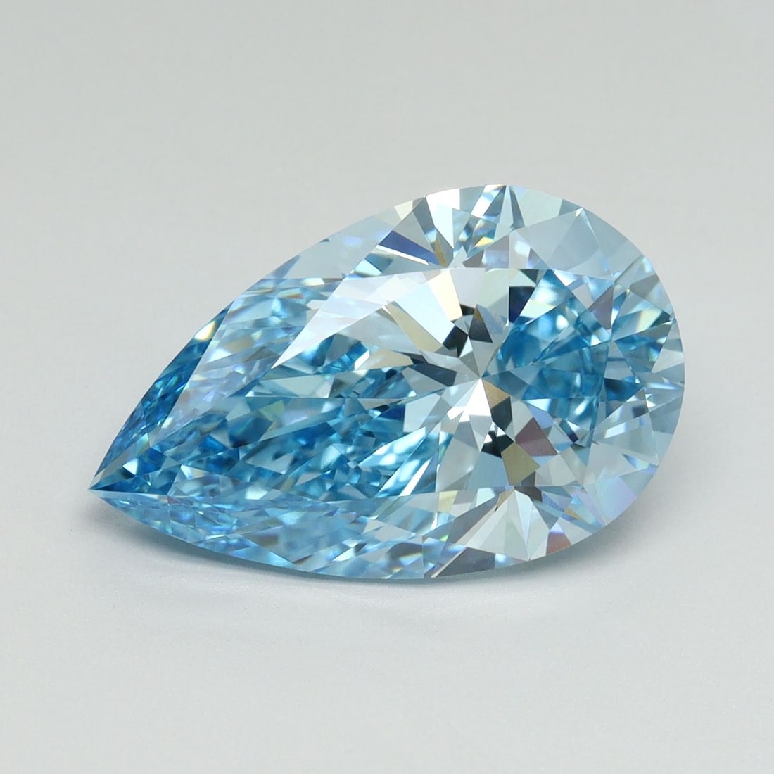 Loose Lab Diamond - IGI Pear 5.01ct Fancy Vivid Blue VVS2: Loose Lab Diamond - IGI Pear 5.01ct Fancy Vivid Blue VVS2 Experience the breathtaking beauty of a lab-grown diamond, certified by the International Gemological Institute (IGI) as Fancy Vivid Blue, wit