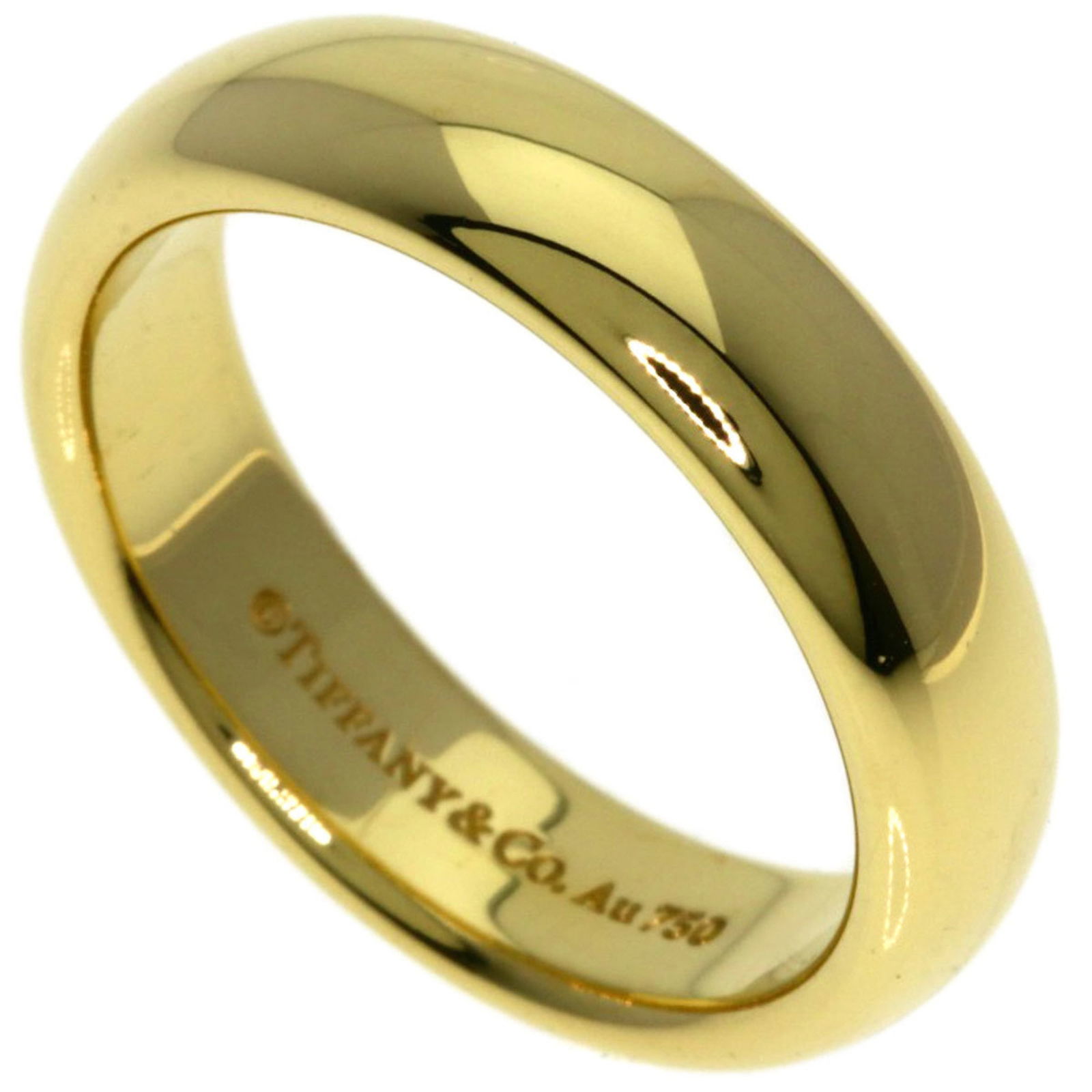 (18K) Tiffany Wedding Ring Yellow Gold: (18K) Tiffany Wedding Ring Yellow Gold A stunning 18K yellow gold Tiffany wedding ring, perfect for the romantic bride-to-be, boasts a classic design and exceptional craftsmanship. With its 4.4mm widt
