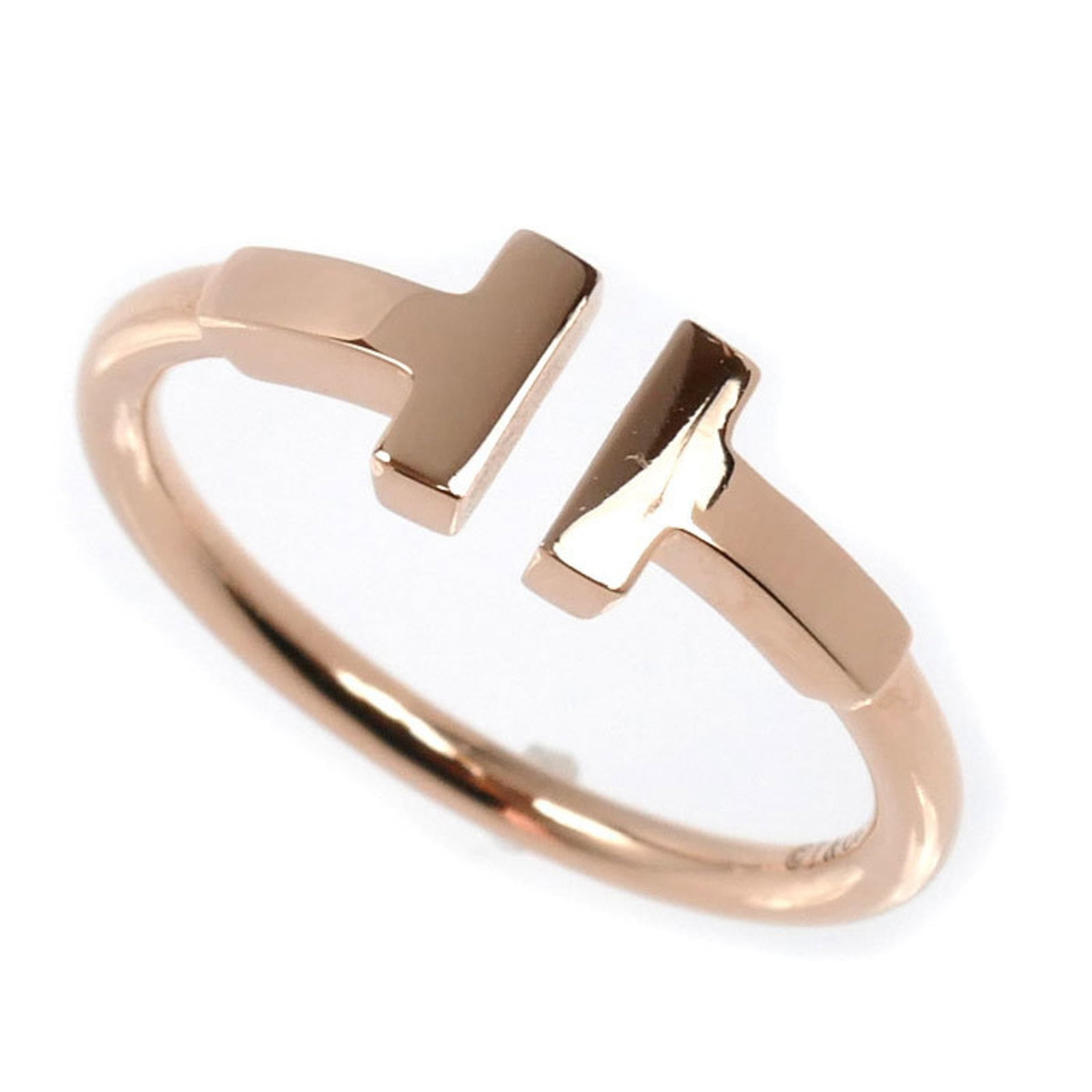 Pink Gold 18K Tiffany Band Ring: Pink Gold 18K Tiffany Band Ring Elevate your style with the timeless elegance of Tiffany's iconic pink gold band ring, crafted from 18K precious metal and boasting a sleek, sophisticated design that c