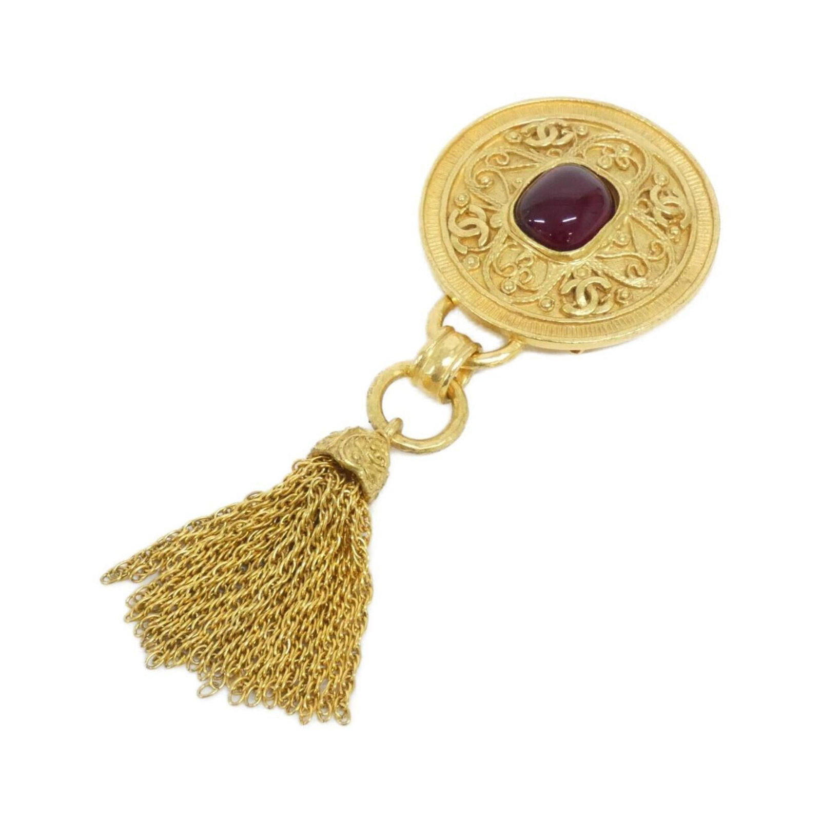 Brooch Chanel: Brooch Chanel A stunning Chanel brooch, crafted in luxurious gold and bold red hues, adds a touch of timeless elegance to any outfit. With its sleek 12cm x 4.8cm size, this beautiful piece is perfect
