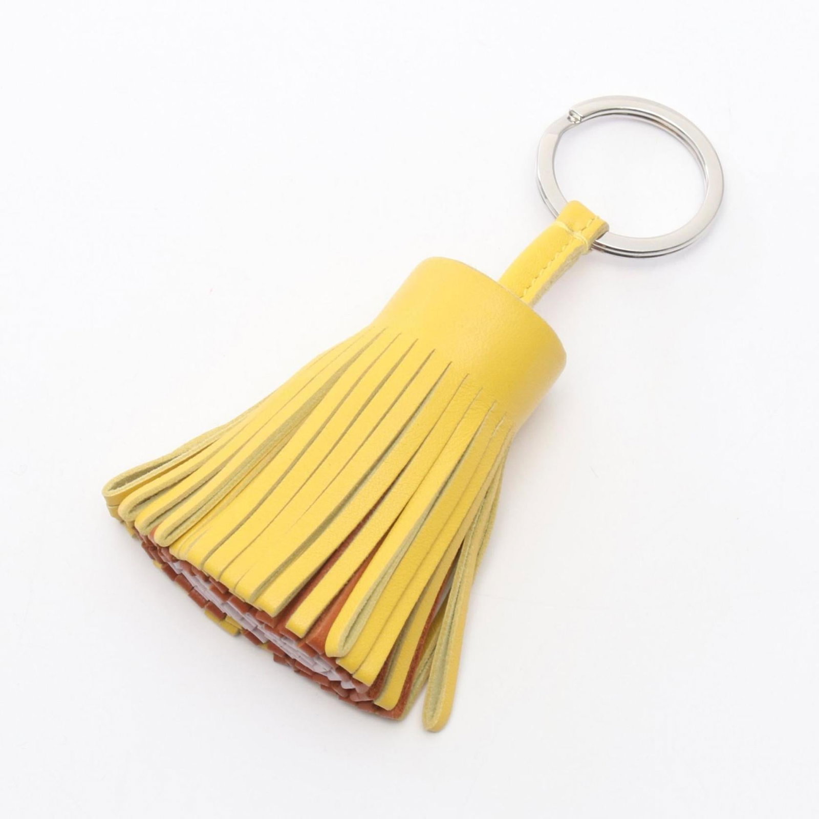 Hermes Agneau Milo Handbag Charm: Hermes Agneau Milo Handbag Charm A rare and elegant accessory for the discerning handbag collector, this Hermes Agneau Milo Handbag Charm boasts a rich brown finish, subtle pink undertones, and a touc