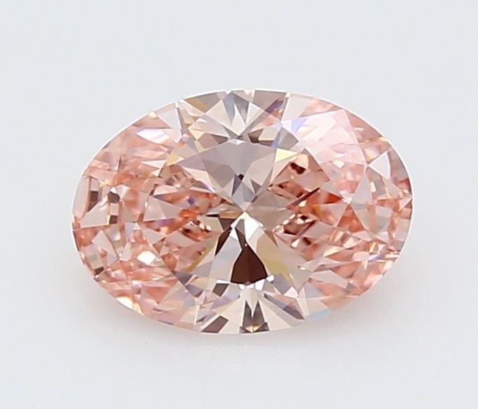 IGI Oval 1.5ct Fancy Vivid Pink VVS2 Loose Lab Diamond: IGI Oval 1.5ct Fancy Vivid Pink VVS2 Loose Lab Diamond Experience the rare beauty of a Fancy Vivid Pink diamond, one of the most coveted colors in the world of gemstones. This exquisite 1.5ct lab-grow