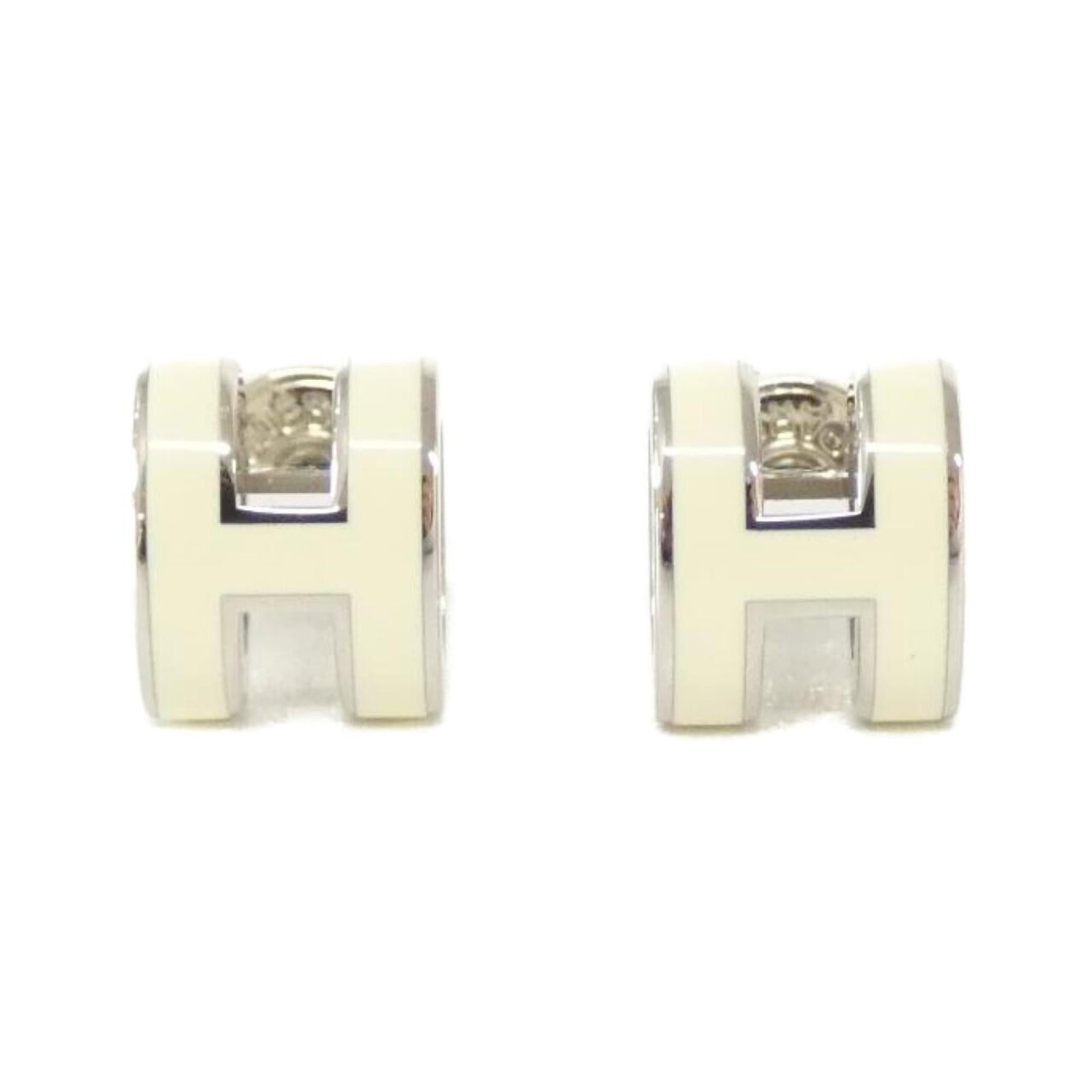 Earrings Hermes Stud: Earrings Hermes Stud Authentic Herm?s stud earrings in silver and white, with a sleek 9mm x 7mm design that adds a touch of timeless elegance to any outfit. With their classic stud style and high-qual