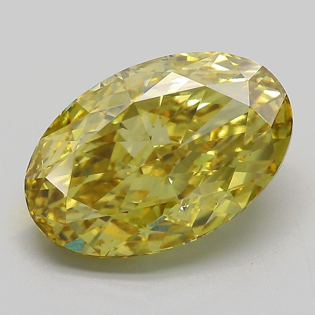IGI Oval 5.52ct Fancy Vivid Yellow VVS2 Diamond: IGI Oval 5.52ct Fancy Vivid Yellow VVS2 Diamond Experience the vibrant beauty of nature in this stunning 5.52ct Fancy Vivid Yellow VVS2 diamond, certified by the International Gemological Institute