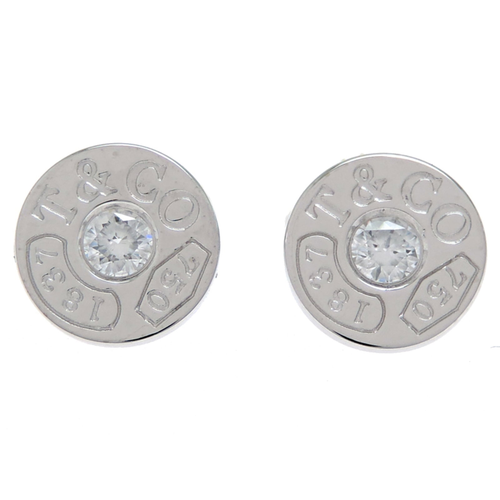 (18K) Tiffany Stud Earrings White Gold: (18K) Tiffany Stud Earrings White Gold Elevate your style with these stunning 18K white gold Tiffany stud earrings, boasting a beautiful diamond setting that adds a touch of sophistication to any outf