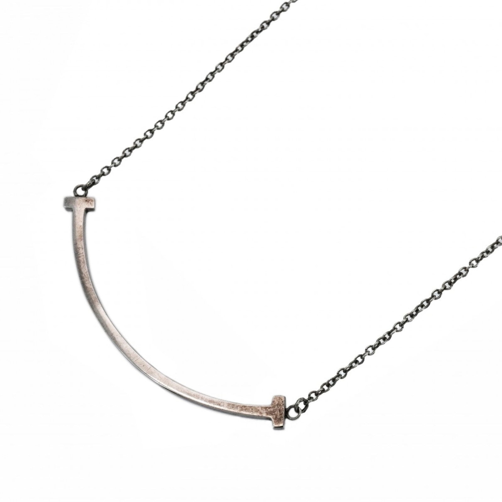 Tiffany & Co. Sterling Silver T Smile Necklace for Women: Tiffany & Co. Sterling Silver T Smile Necklace for Women Elevate your style with the timeless Tiffany & Co. Sterling Silver T Smile Necklace, crafted from high-quality 925 silver that adds a touch of