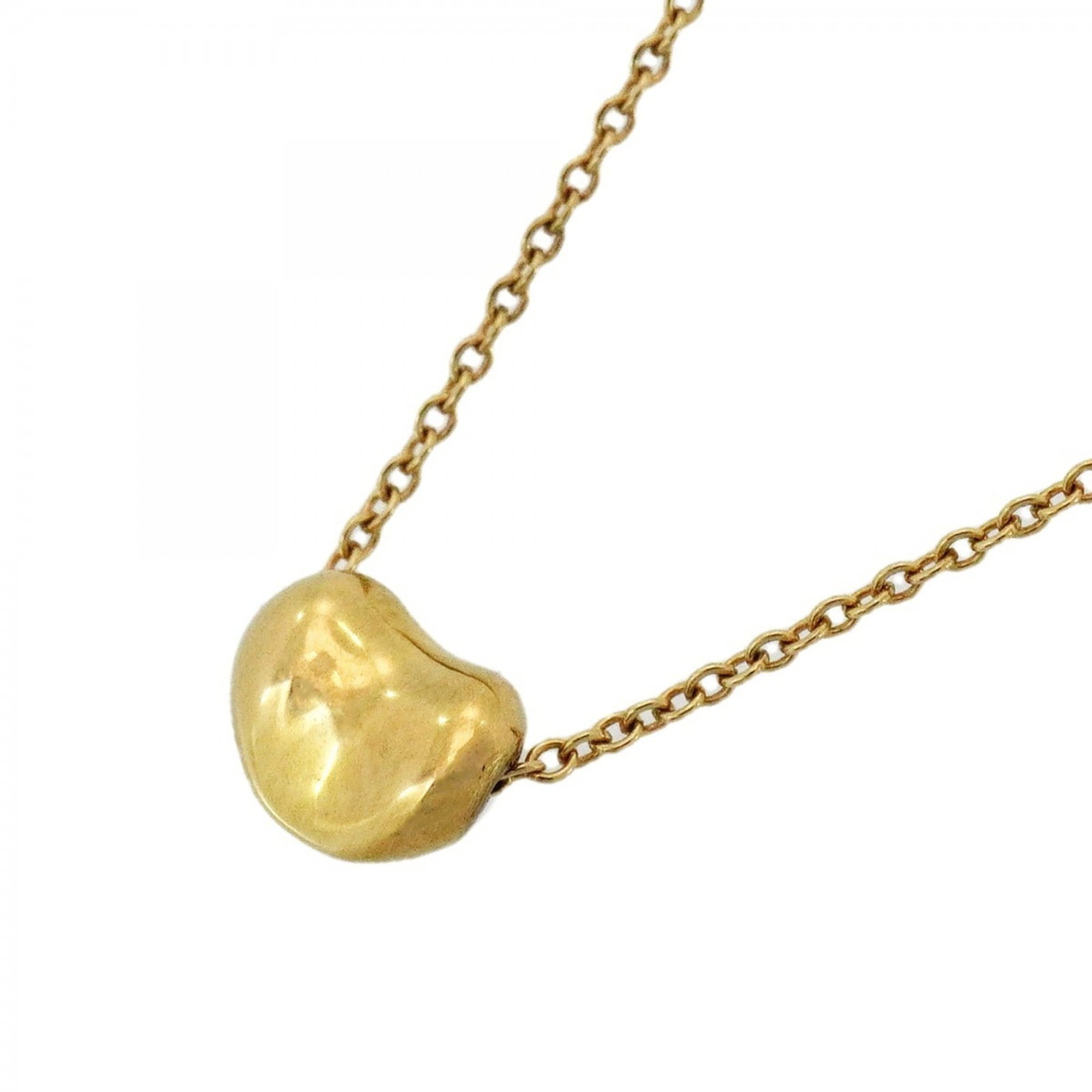 Tiffany & Co. 18K Yellow Gold Women's Bean Necklace: Tiffany & Co. 18K Yellow Gold Women's Bean Necklace Elegant and sophisticated, the Tiffany & Co. 18K Yellow Gold Bean Necklace is a timeless piece that exudes classic style. With its delicate 5mm x 6.