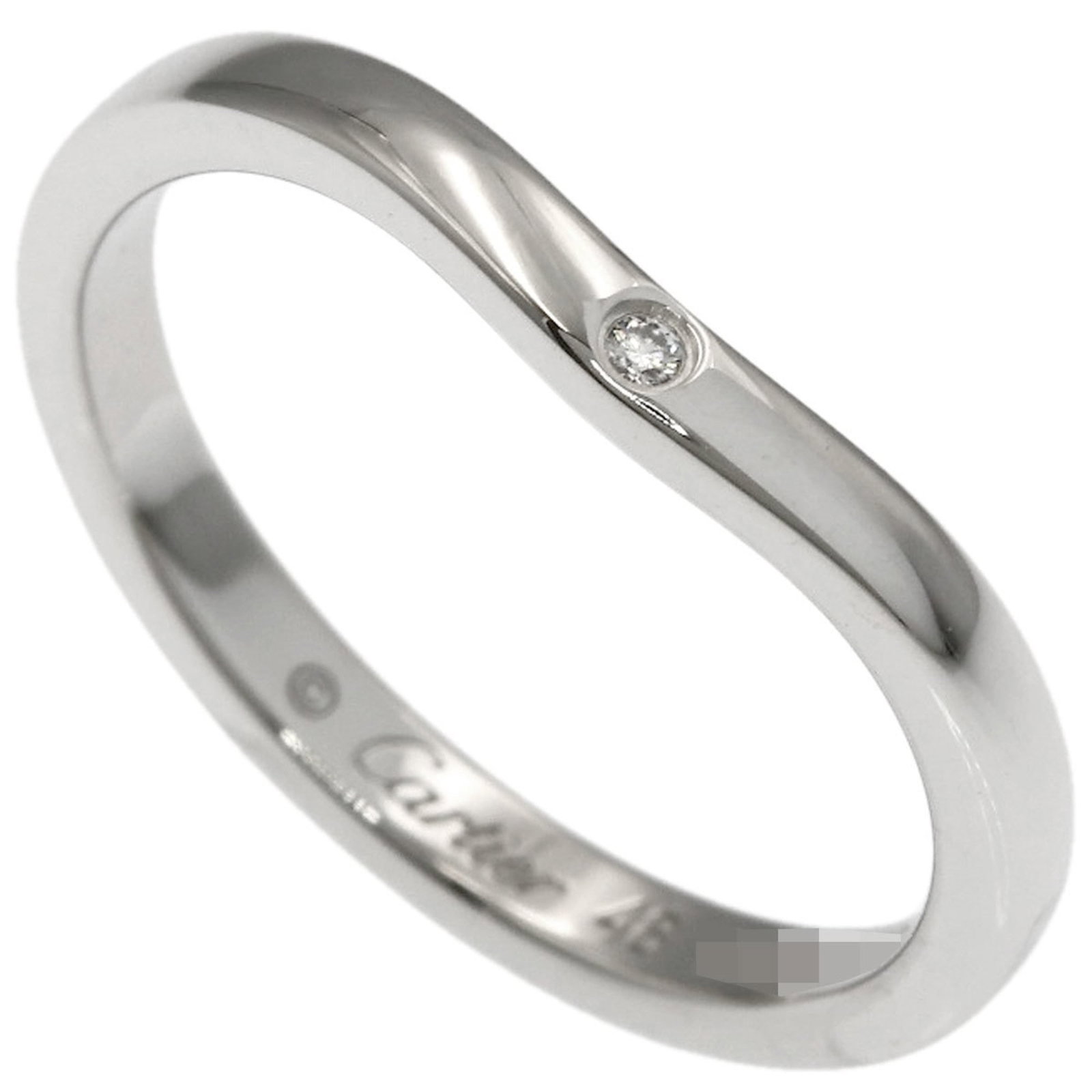 Cartier Platinum 950 Band Ring: Cartier Platinum 950 Band Ring A stunning Cartier band ring in platinum 950, adorned with a sparkling diamond, adds a touch of timeless elegance to any outfit. With its sleek design and premium materi