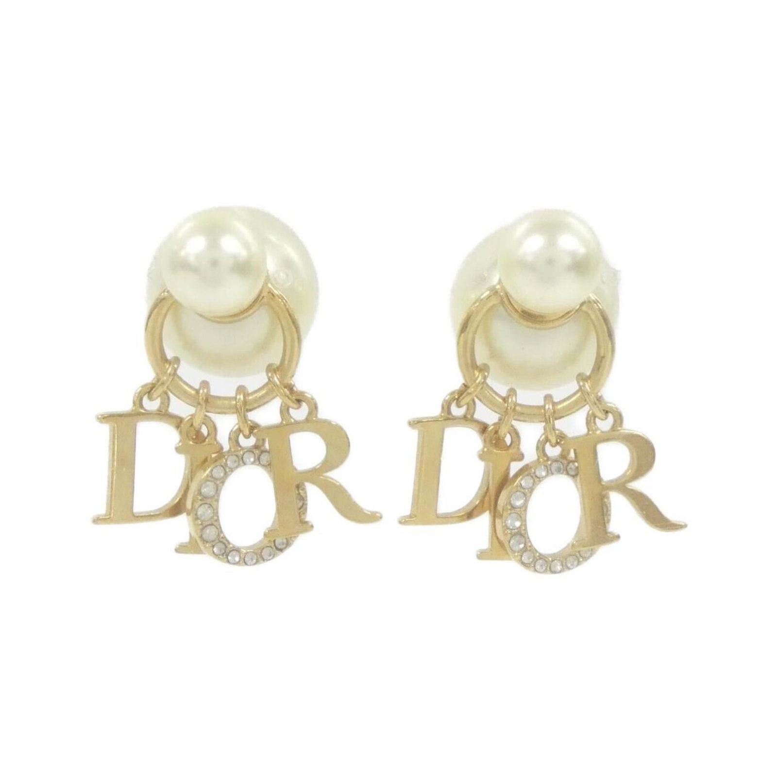 Earrings Christian Dior Stud: Earrings Christian Dior Stud Elevate your everyday look with these stunning Christian Dior stud earrings, featuring clear, gold, and white details that add a touch of luxury to any outfit. With their