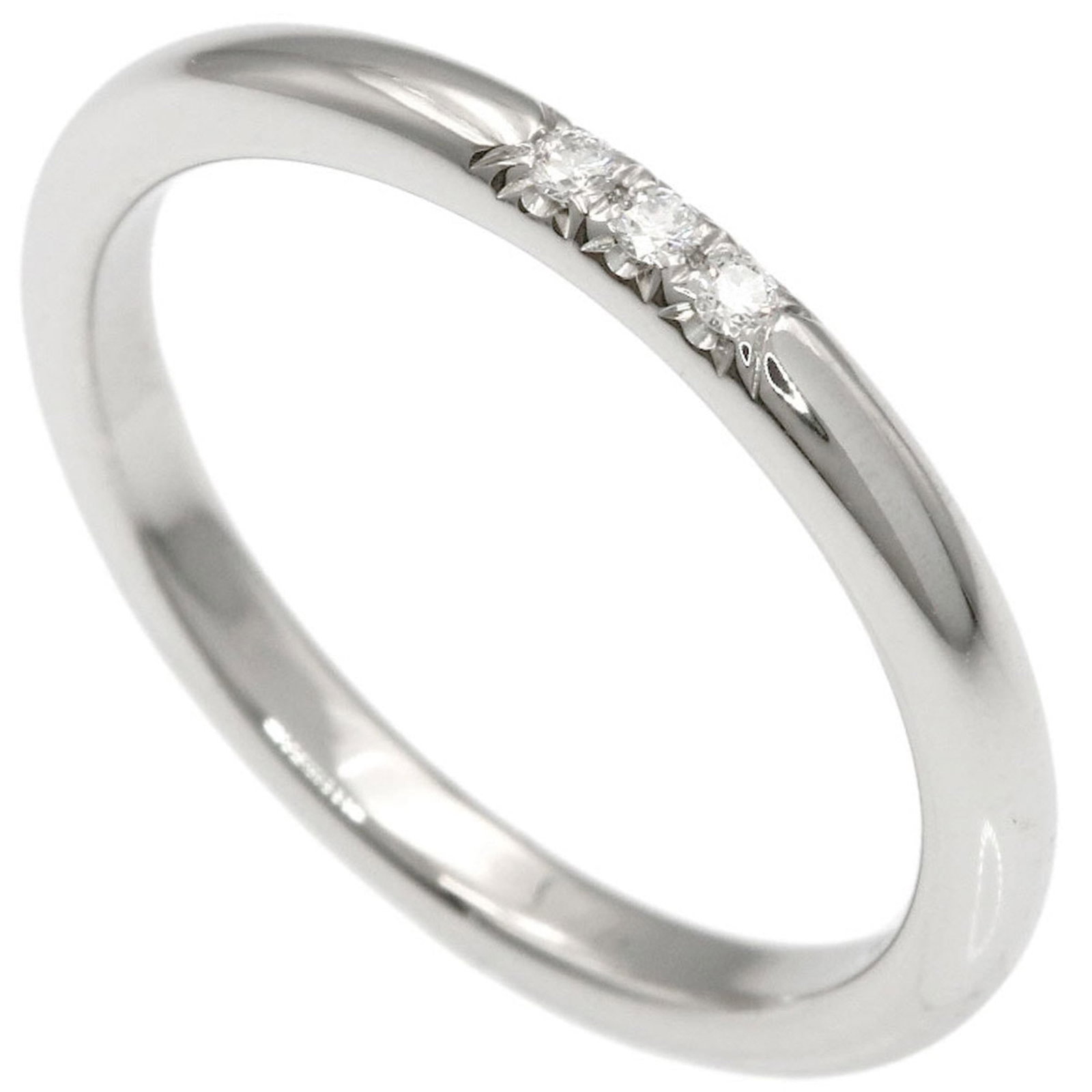 950 Tiffany Band Ring Platinum: 950 Tiffany Band Ring Platinum A stunning 950 Tiffany Band Ring Platinum, adorned with a beautiful diamond stone, adds a touch of elegance to any outfit. In excellent condition despite being worn, thi