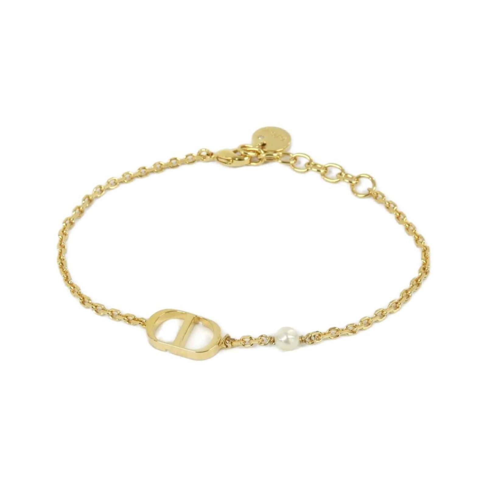 Bracelet Christian Dior Charm: Bracelet Christian Dior Charm A delicate gold charm from the iconic Christian Dior brand adds a touch of luxury to any outfit with its elegant design and subtle shine. This versatile charm bracelet is