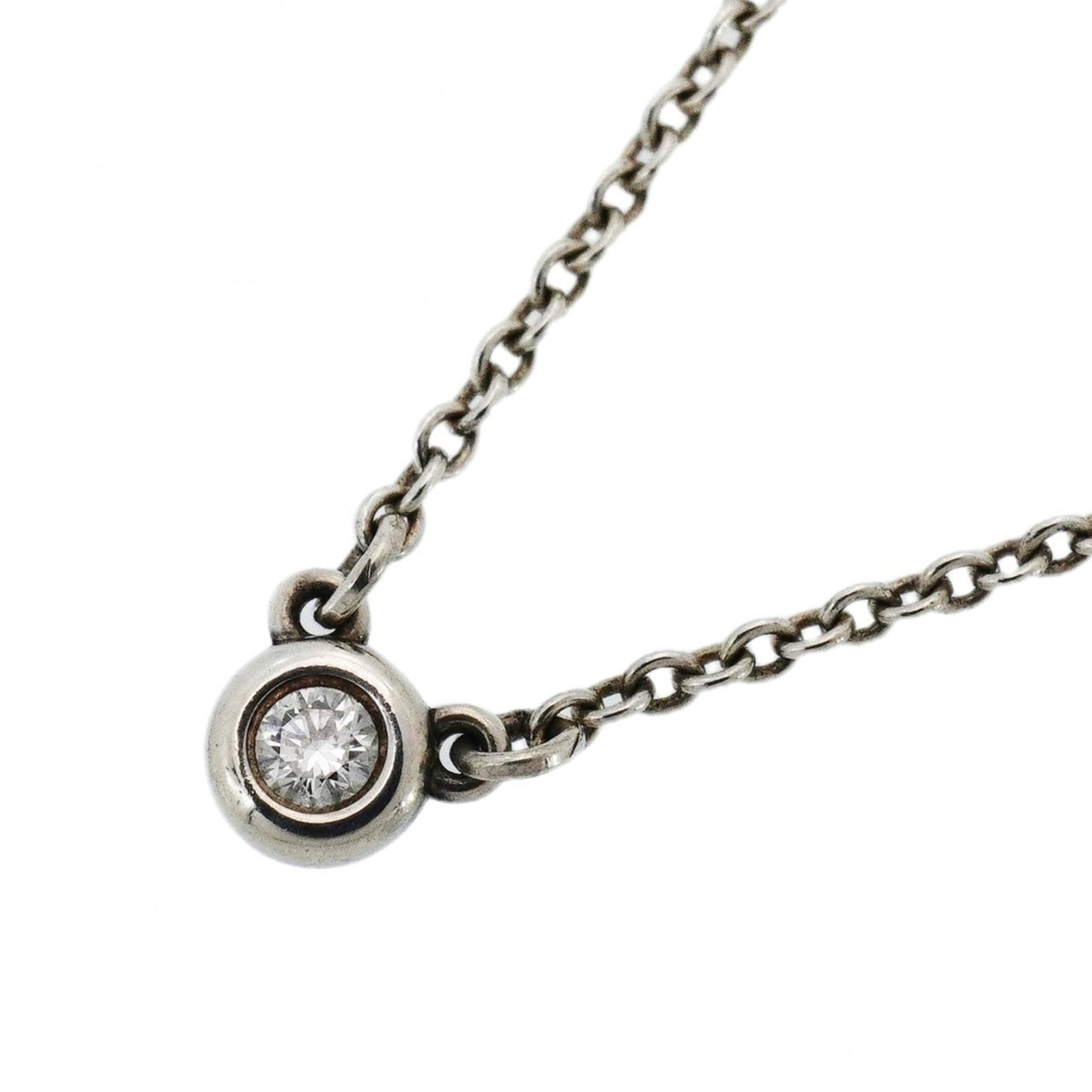 Tiffany & Co. Sterling Silver 925 One Diamond Women's Necklace by the Yard: Tiffany & Co. Sterling Silver 925 One Diamond Women's Necklace by the Yard Elegant and sophisticated, this Tiffany & Co. sterling silver necklace showcases a beautiful 925 diamond pendant, set against