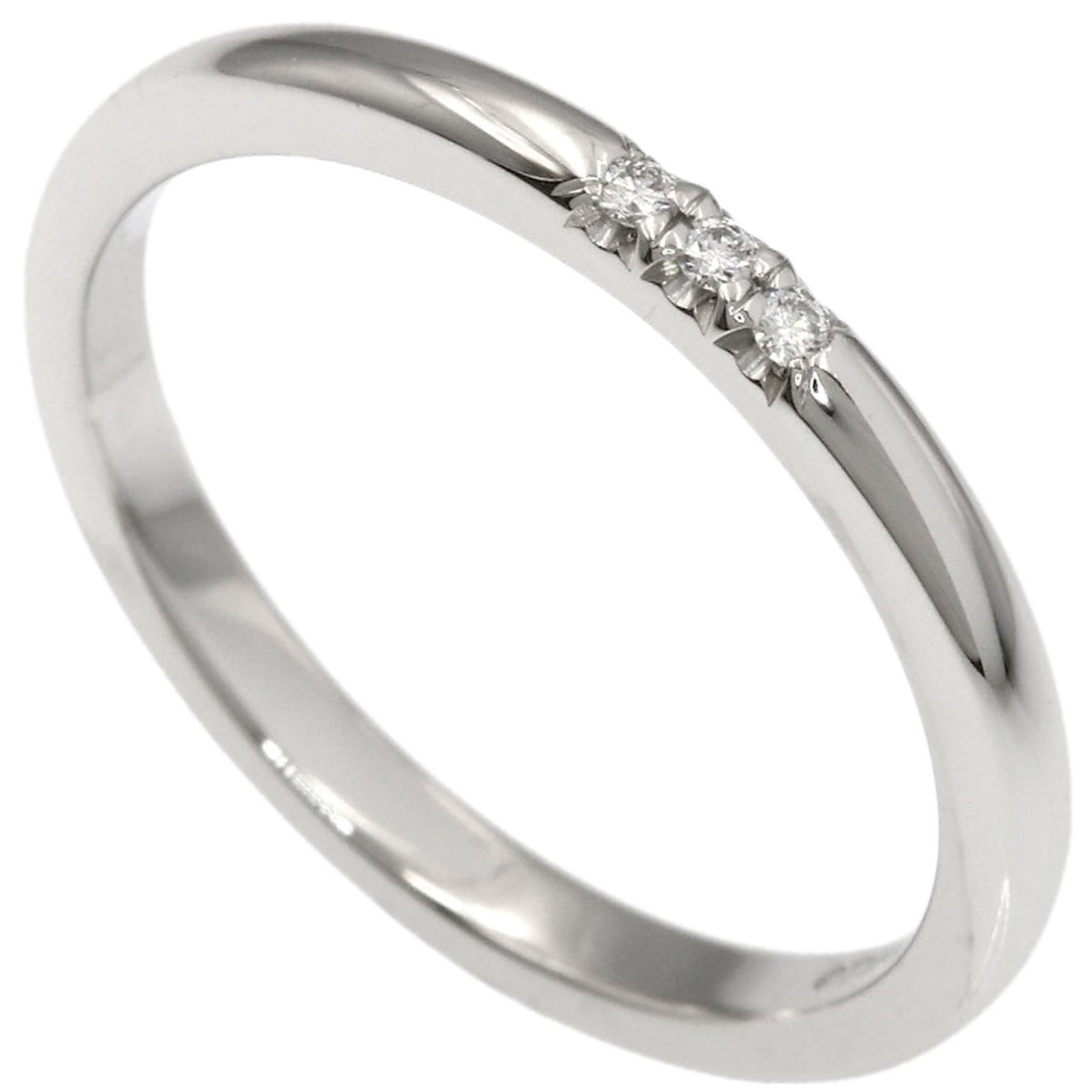 950 Tiffany Band Ring Platinum: 950 Tiffany Band Ring Platinum Experience the timeless elegance of Tiffany & Co.'s iconic 950 Platinum band ring, adorned with a stunning diamond stone. This pre-owned beauty boasts excellent conditio