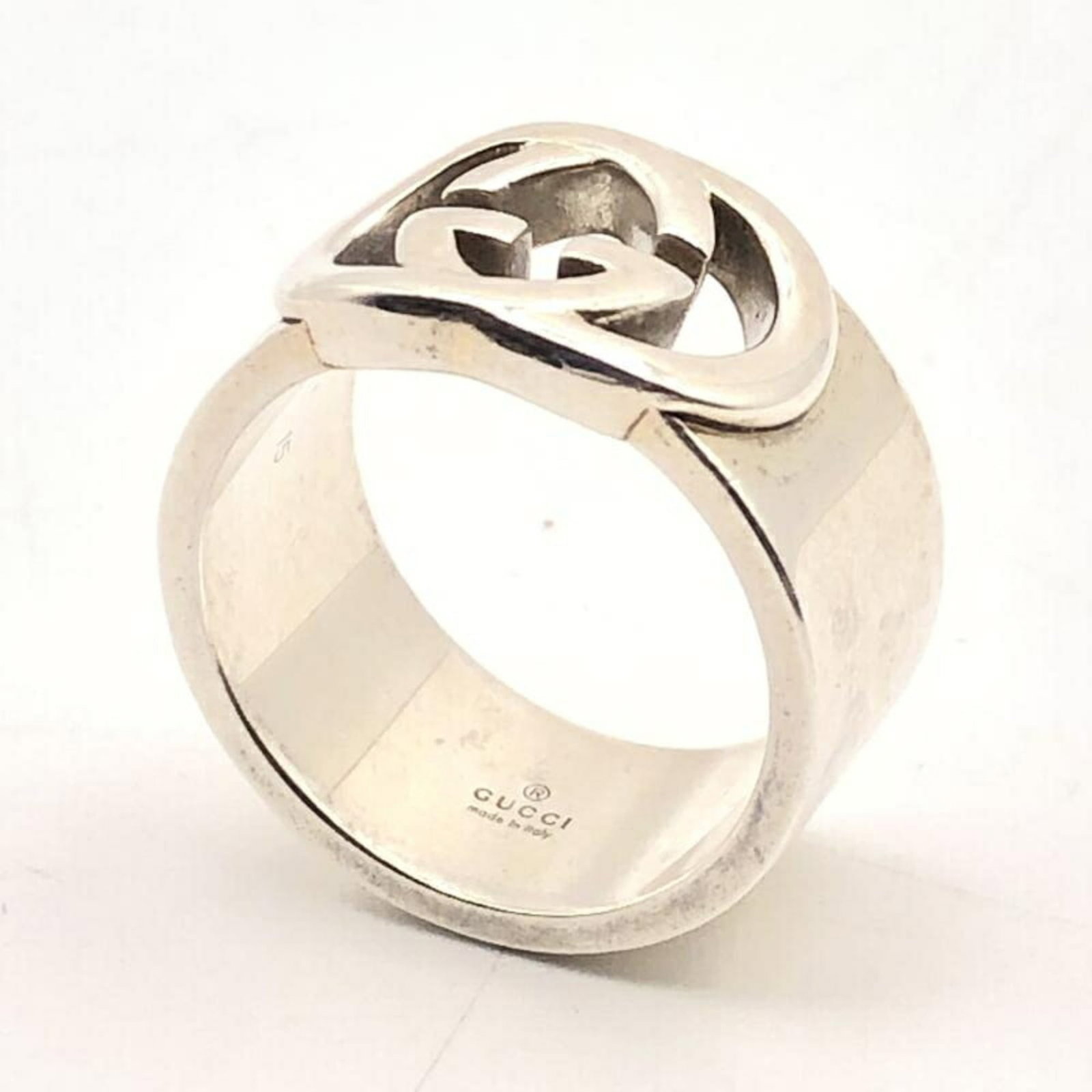 Gucci Interlocking G Silver Bullet Wide Ring: Gucci Interlocking G Silver Bullet Wide Ring Add a touch of edgy sophistication to your style with the Gucci Interlocking G Silver Bullet Wide Ring, a statement piece that combines sleek metallic silv