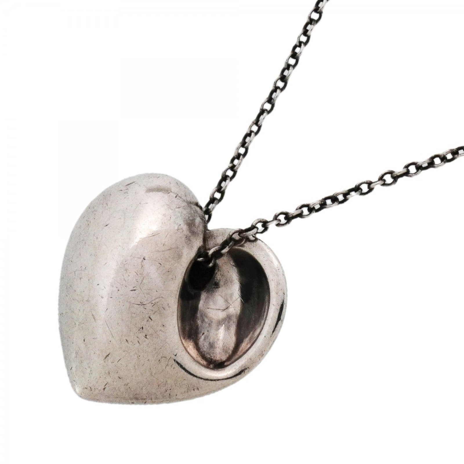 Tiffany & Co. Sterling Silver 925 Fold Heart Necklace for Women: Tiffany & Co. Sterling Silver 925 Fold Heart Necklace for Women Elegant and timeless, the Tiffany & Co. Sterling Silver 925 Fold Heart Necklace is a sophisticated accessory for any woman. With its del