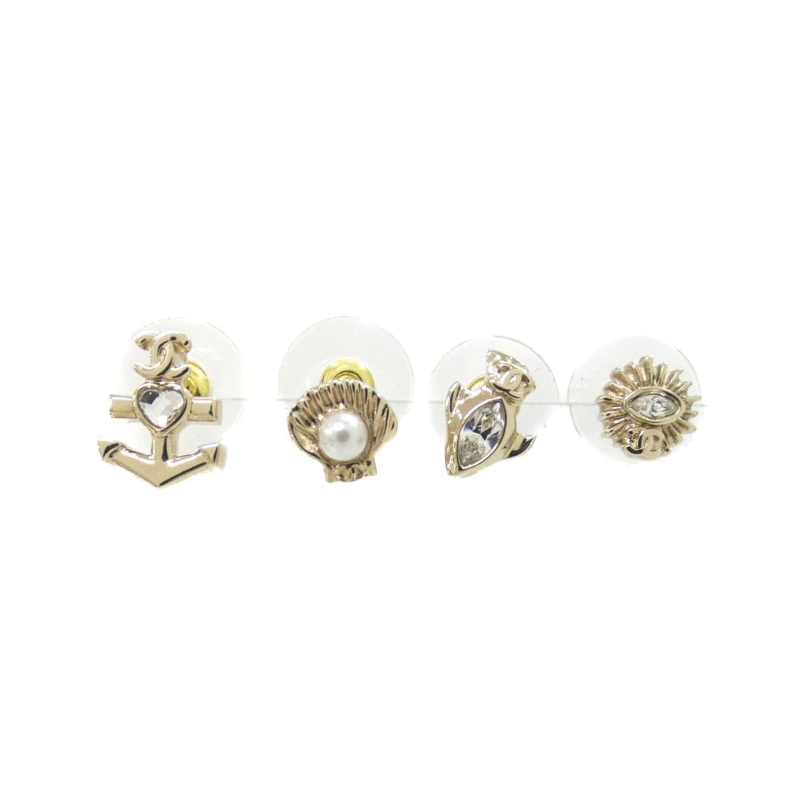 Earrings Chanel Stud: Earrings Chanel Stud Authentic Chanel stud earrings in gold and white, featuring the iconic interlocking CC logo. With their sleek design and timeless elegance, these earrings are perfect for adding a