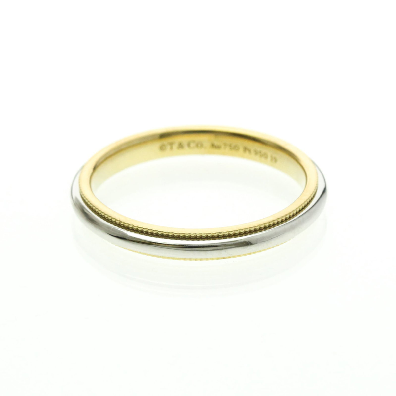 Yellow Gold (18K) - Tiffany Band Ring Platinum: Yellow Gold (18K) - Tiffany Band Ring Platinum A stunning Tiffany band ring in 18K yellow gold and platinum, crafted with sleek lines and a slender profile that adds a touch of sophistication to any o