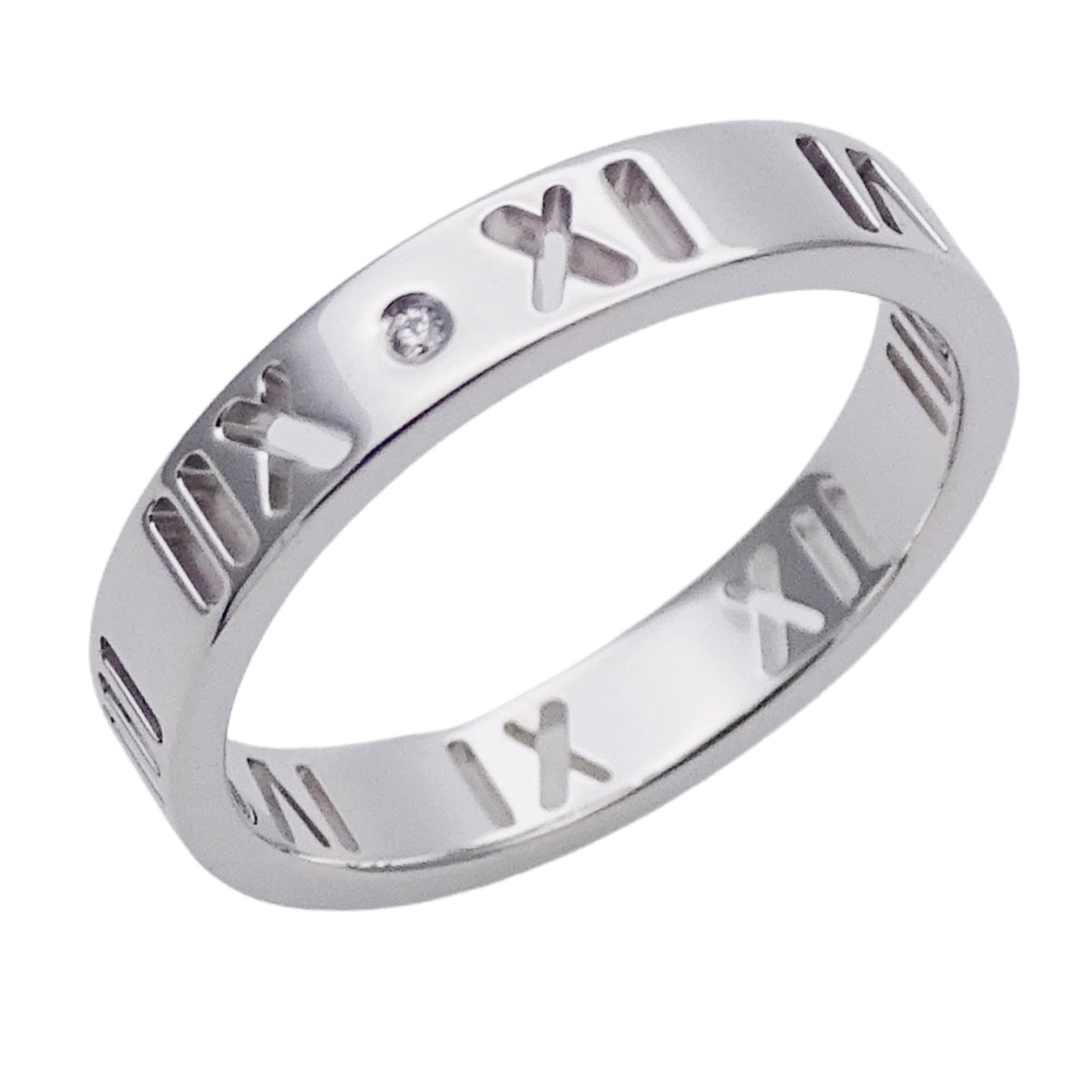 (18K) Tiffany Band Ring White Gold: (18K) Tiffany Band Ring White Gold A stunning 18K white gold band ring from Tiffany & Co., adorned with a beautiful diamond, adds a touch of timeless elegance to any outfit. With its sleek 3.3mm width