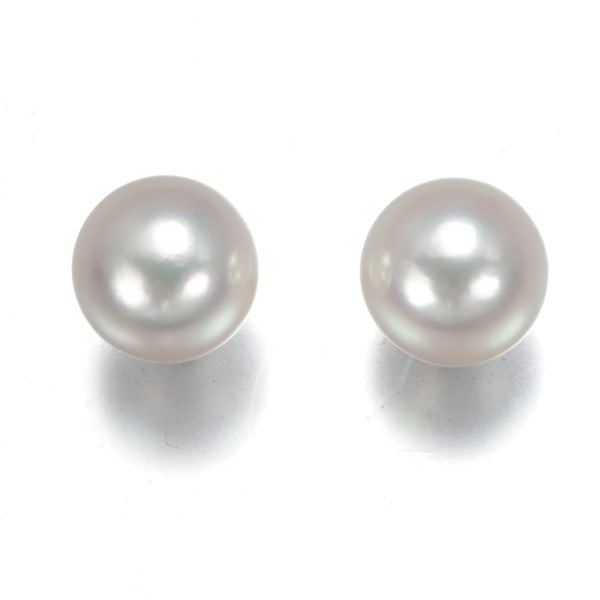 Akoya Pearl Solitaire Earrings in 18K White Gold (7.4mm): Akoya Pearl Solitaire Earrings in 18K White Gold (7.4mm) Elevate your elegance with these stunning Akoya pearl solitaire earrings in 18k white gold, boasting a luminous 7.4mm pearl that shines against