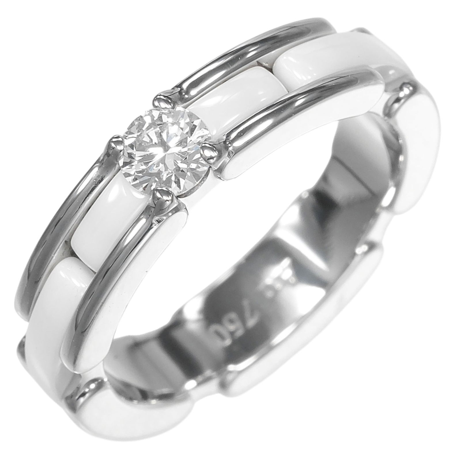 White Gold (18K) - Chanel Band Ring Ceramic: White Gold (18K) - Chanel Band Ring Ceramic A stunning Chanel band ring, crafted from 18K white gold and adorned with a sparkling diamond, sits atop a sleek ceramic base. The elegant design makes for