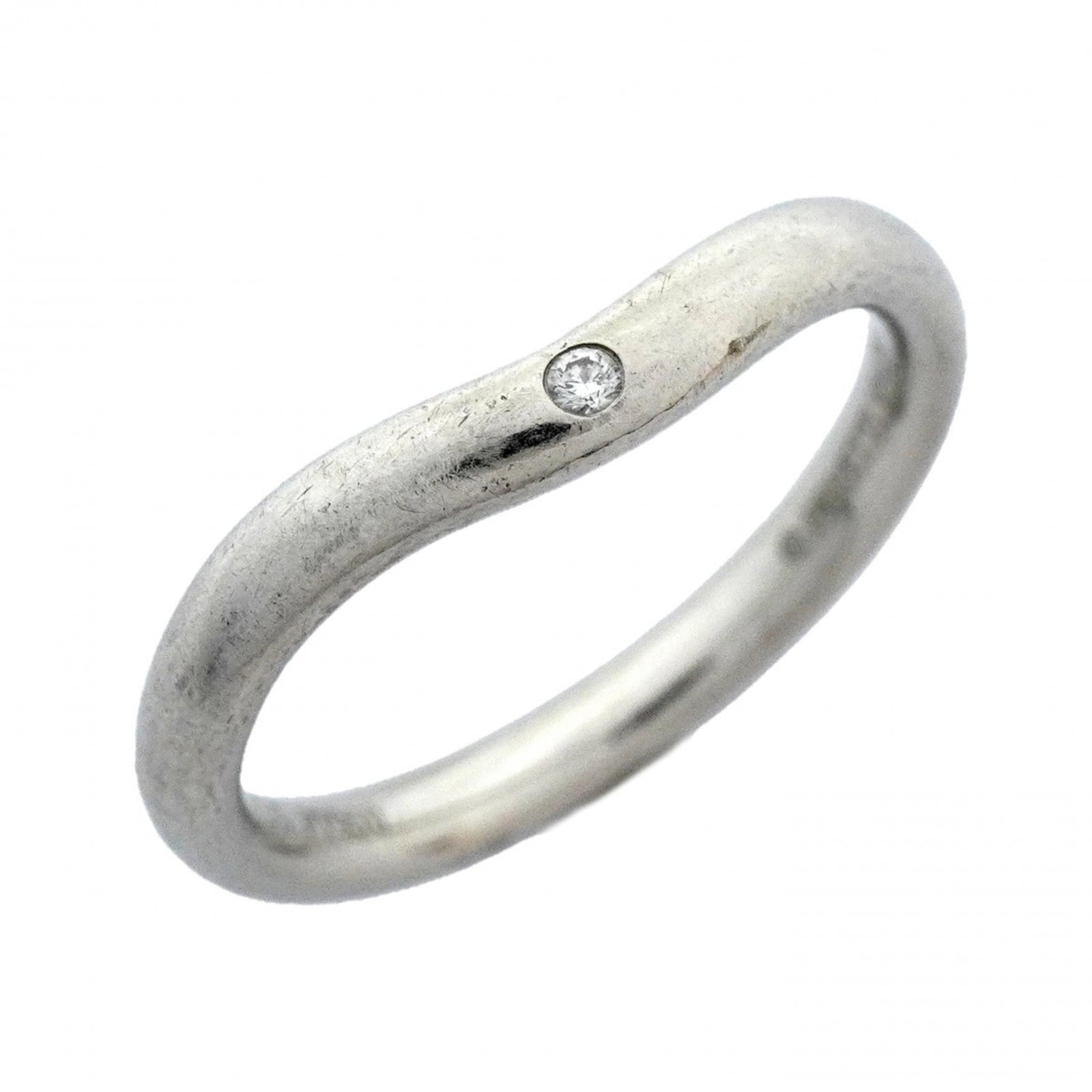 950 Tiffany Band Ring Platinum: 950 Tiffany Band Ring Platinum A stunning 950 platinum band ring from Tiffany & Co., adorned with a beautiful diamond stone, adds a touch of timeless elegance to any outfit. With its sleek platinum de