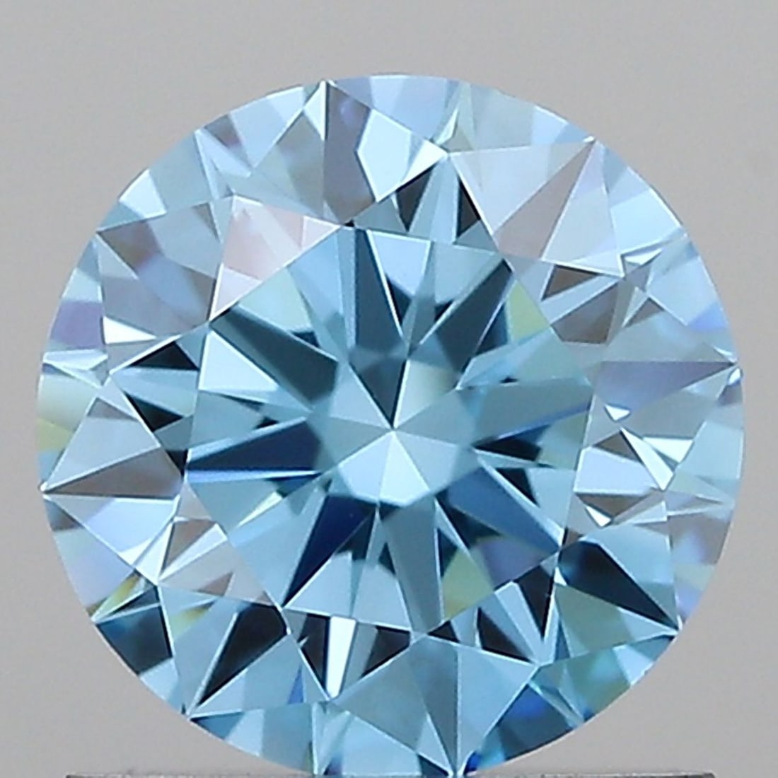 IGI Round 1.0ct Fancy Vivid Blue VVS1 Ideal Loose Lab Diamond: IGI Round 1.0ct Fancy Vivid Blue VVS1 Ideal Loose Lab Diamond Experience the rare beauty of a Fancy Vivid Blue diamond, one of the rarest and most coveted colors in nature. This stunning 1.0ct lab-gro