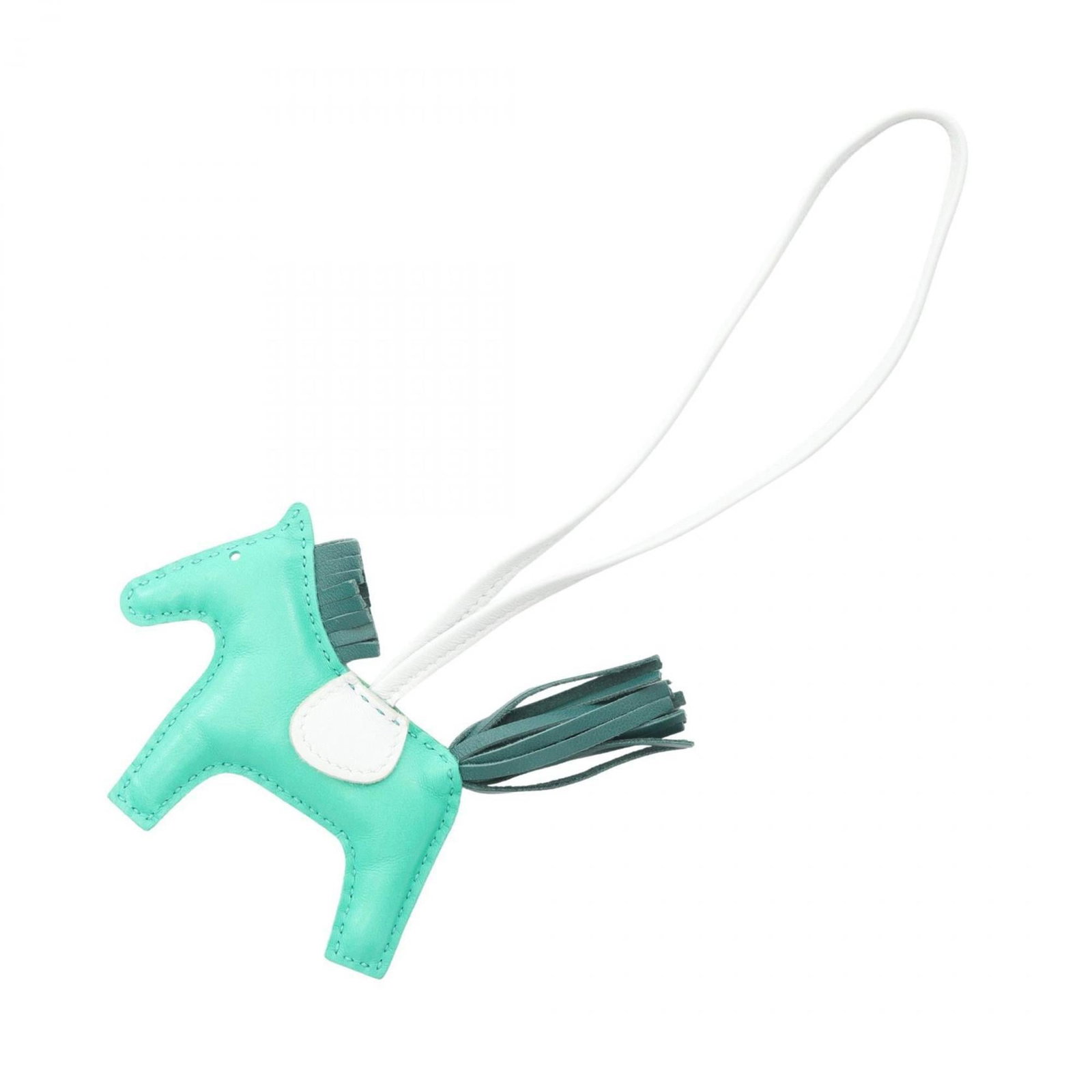 Hermes Agneau Milo Handbag Charm: Hermes Agneau Milo Handbag Charm Add a touch of elegance to your handbag collection with the iconic Hermes Agneau Milo charm, boasting a beautiful blue and green hue that evokes the freshness of sprin