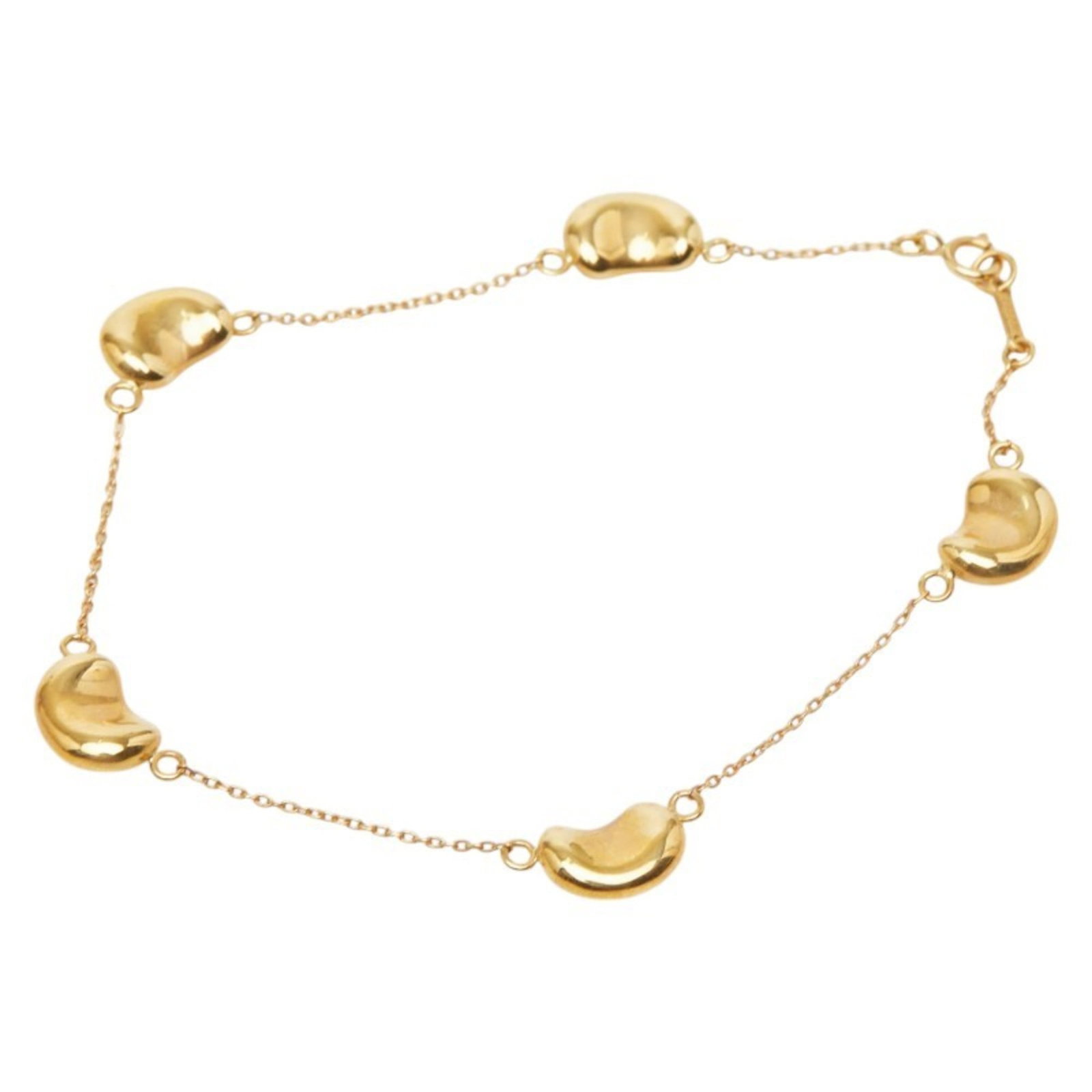 (18K) Tiffany Charm Bracelet Yellow Gold: (18K) Tiffany Charm Bracelet Yellow Gold Elevate your everyday style with the iconic 18K Tiffany charm bracelet in yellow gold, boasting a timeless design that exudes sophistication and elegance. With