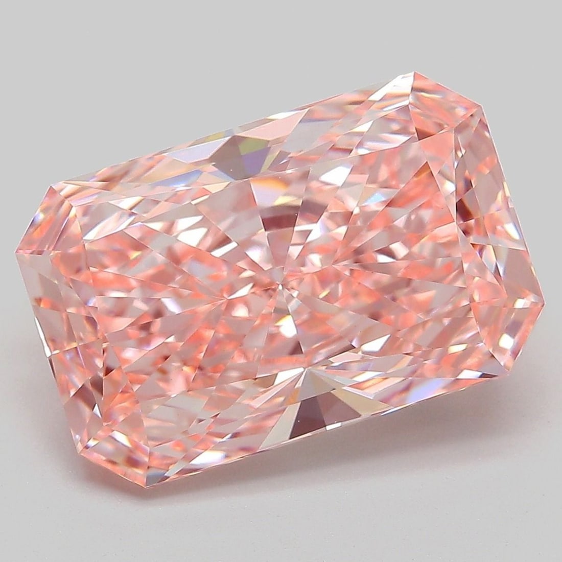 IGI Radiant 7.02ct Fancy Vivid Pink VVS2 Loose Lab Diamond: IGI Radiant 7.02ct Fancy Vivid Pink VVS2 Loose Lab Diamond Experience the breathtaking beauty of a lab-grown diamond, certified by IGI as Fancy Vivid Pink with exceptional clarity and cut. This stunni