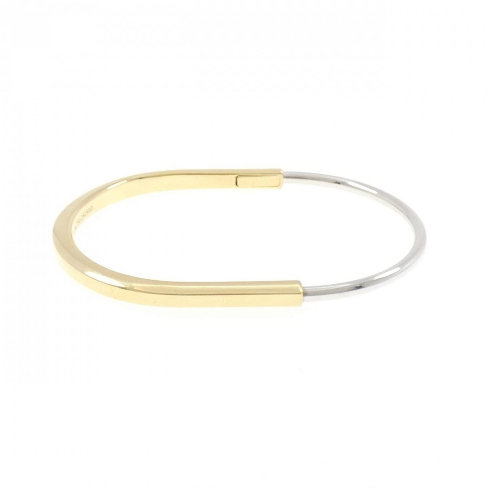 Tiffany Bangle White Gold (18K), Yellow (18K): Tiffany Bangle White Gold (18K), Yellow (18K) A stunning Tiffany bangle in 18K white gold and yellow gold, perfect for adding a touch of elegance to any outfit. With its sleek design and classic style