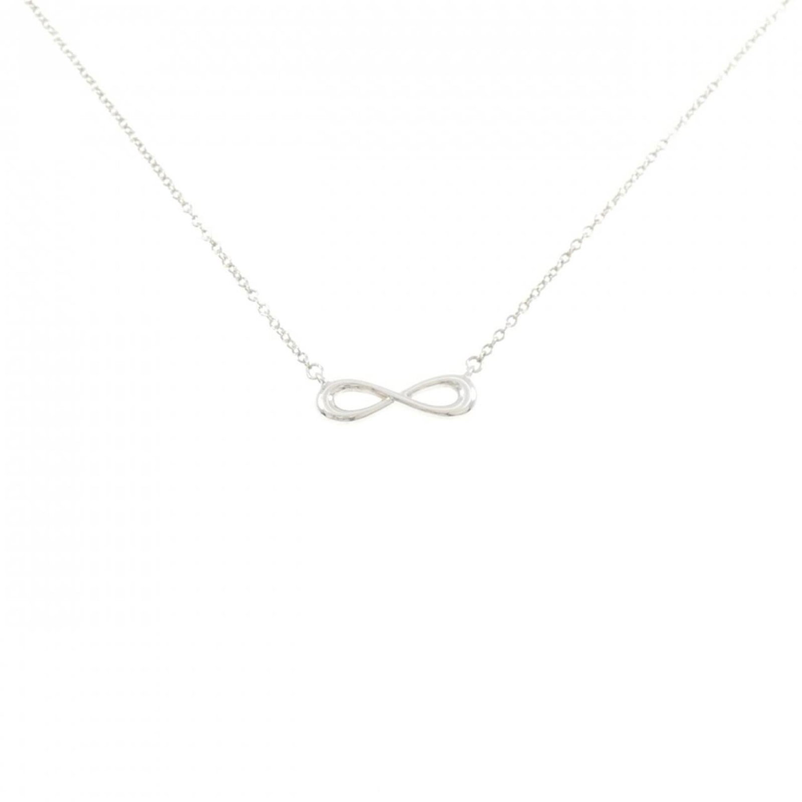 Necklace Tiffany Infinity Mini: Necklace Tiffany Infinity Mini Elevate your everyday style with the timeless Tiffany Infinity Mini necklace, expertly crafted from sterling silver 925. This delicate pendant boasts an iconic infinity